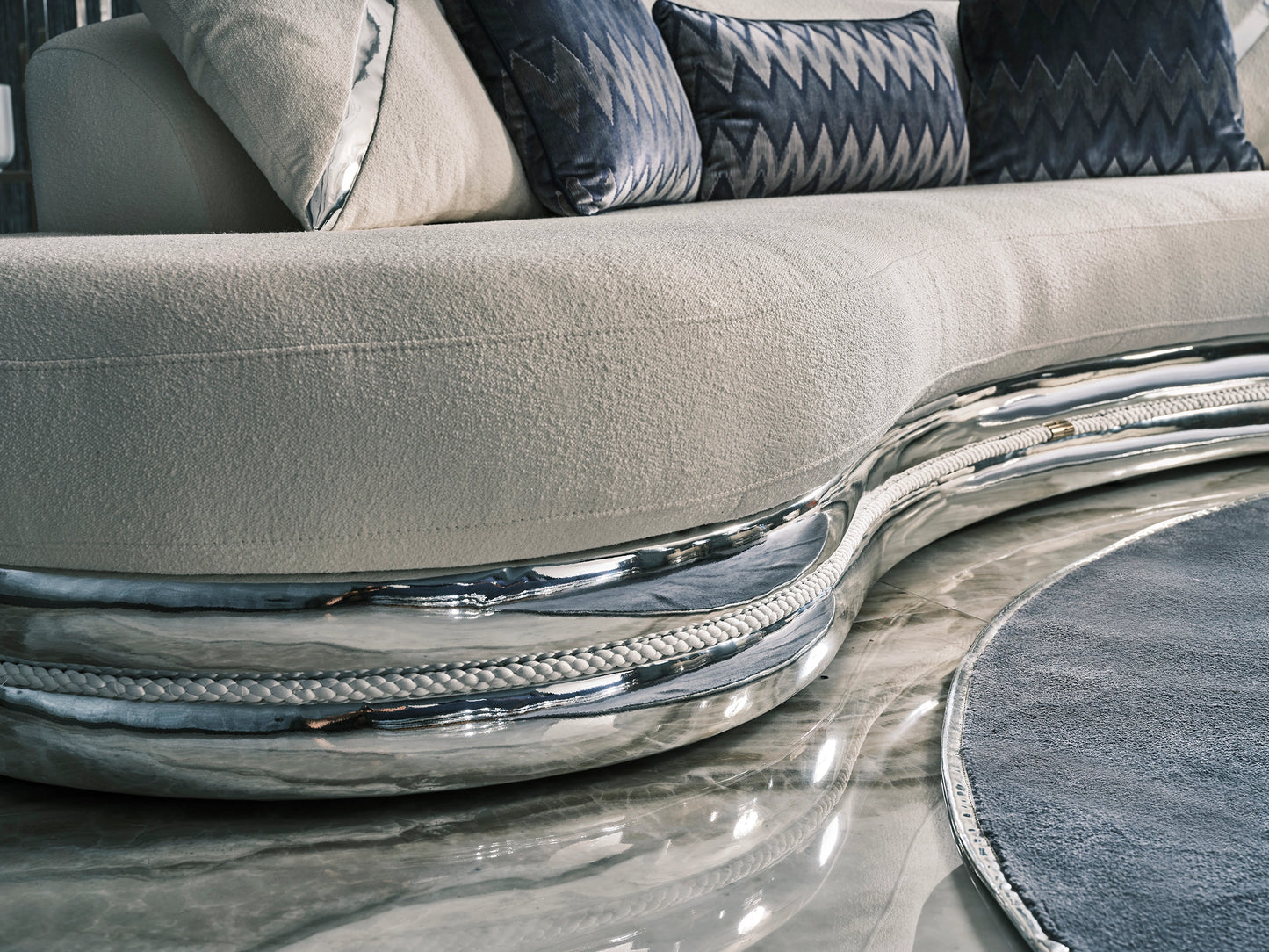Ferre curved 3 seater zoom up to show metla details and fabrics