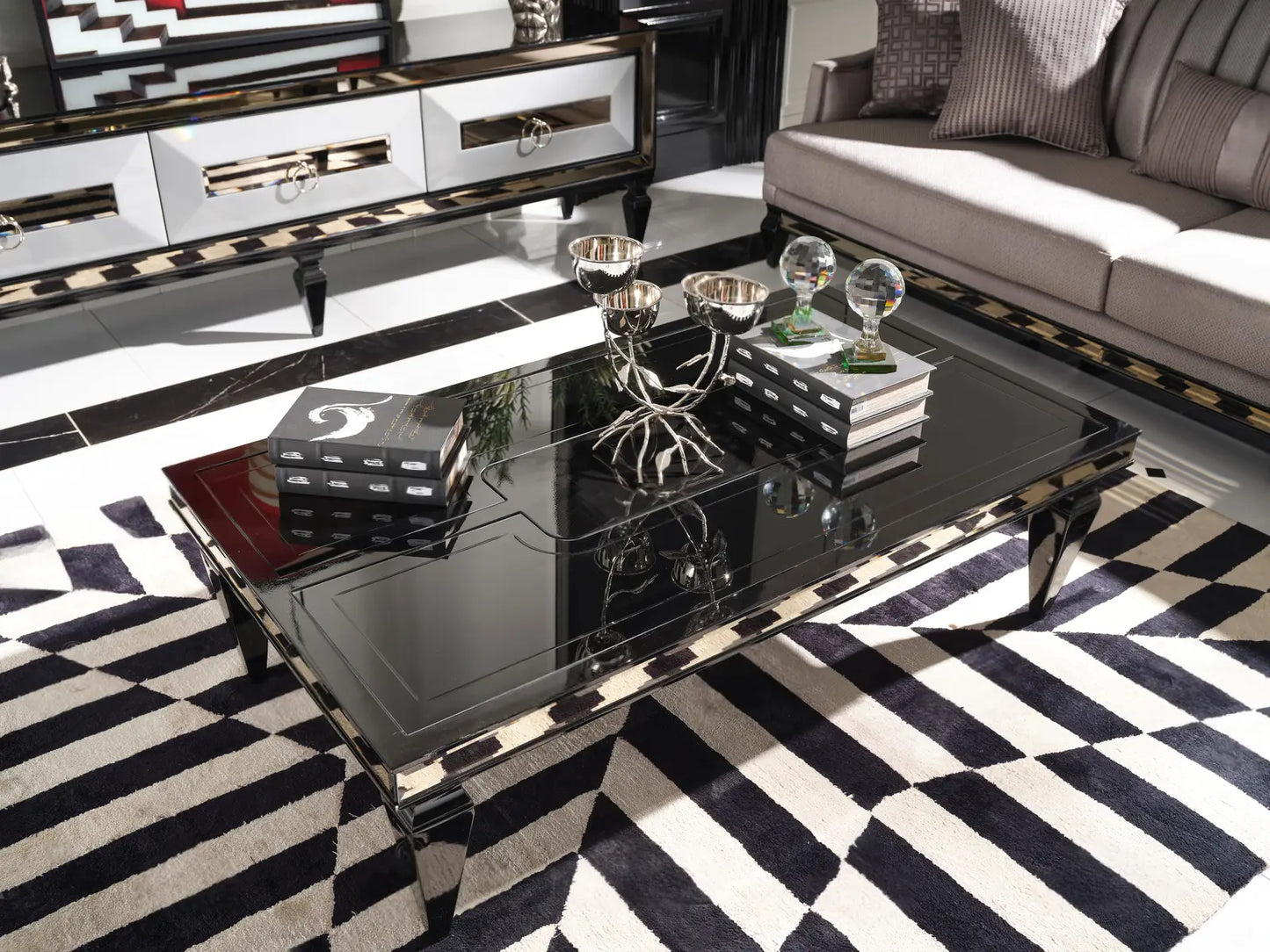 Coffee table from the Havana Dining Set, with a partial view of the TV unit in a stylish living room. Luxe Life Furniture.