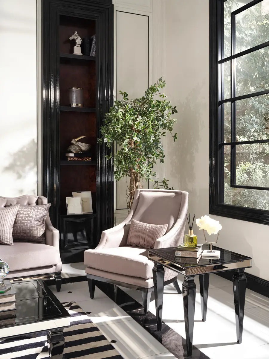 Side table beside an armchair from the Havana Dining Set, arranged in a modern living space. Luxe Life Furniture.