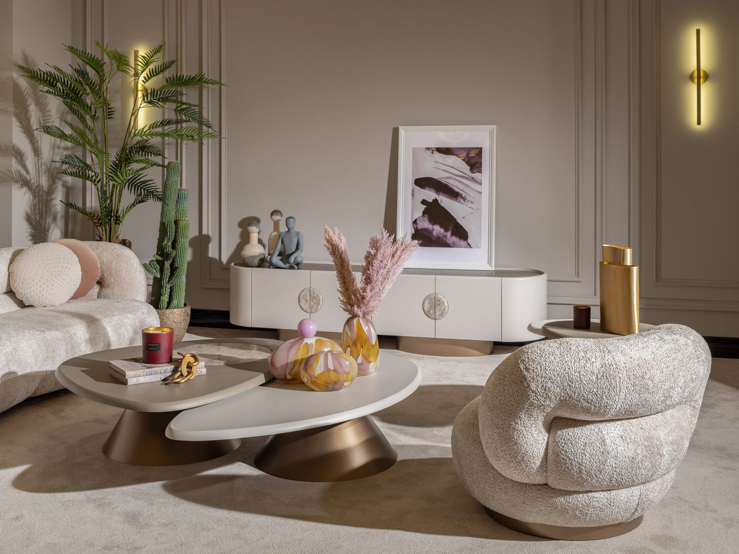 Minimalist oval coffee table styled with soft furnishings