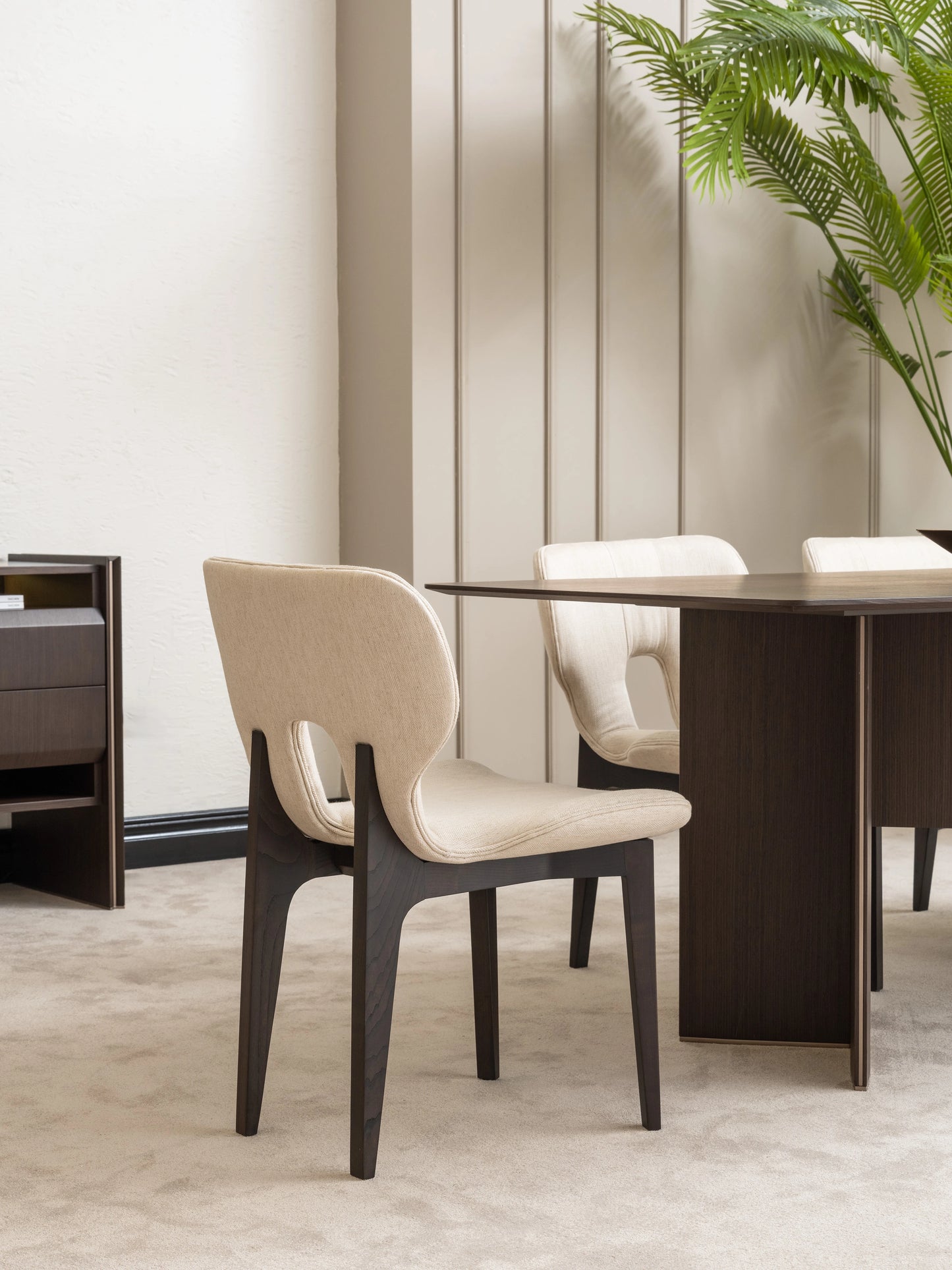 Contemporary Moka dining chair with cream fabric upholstery and dark wood legs