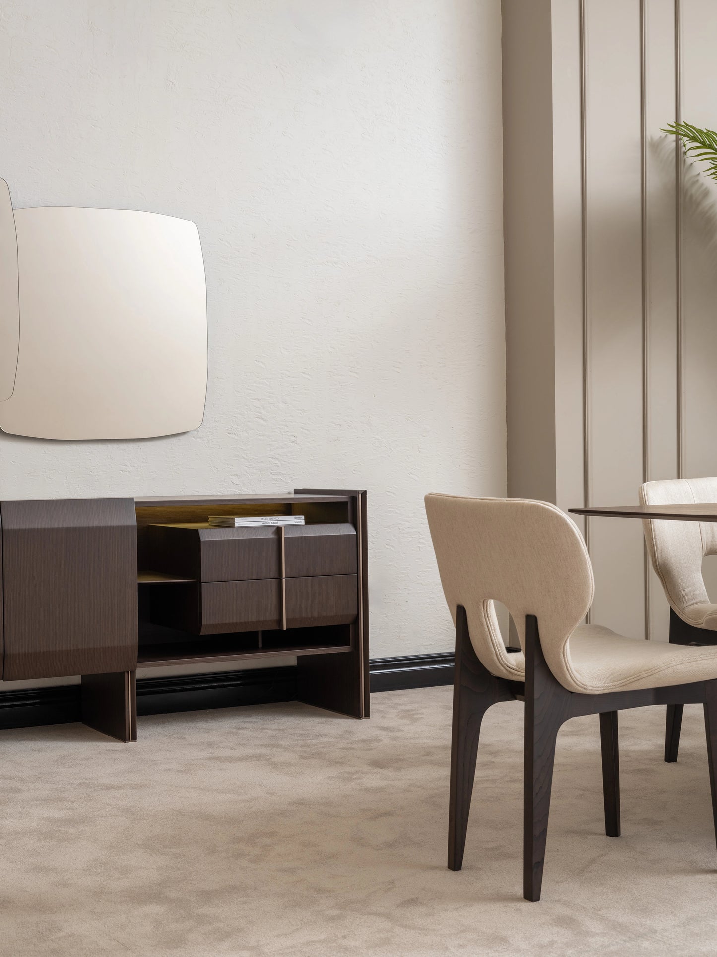 Modern dining room scene with Moka sideboard, mirror and dining chair in focus