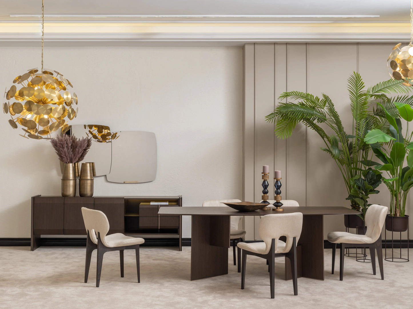 Moka dining set with dark wood table, cream upholstered chairs, sideboard, gold vases, and statement mirror