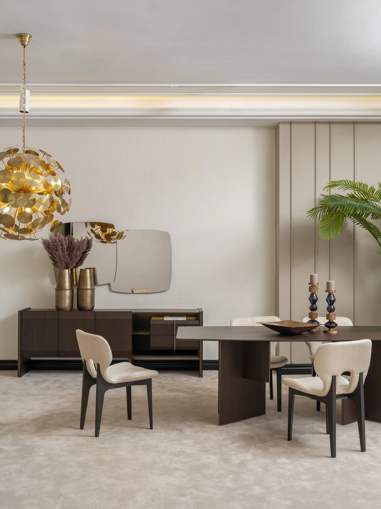 Modern dining room with Moka dining table, cream chairs, and stylish sideboard with gold decor