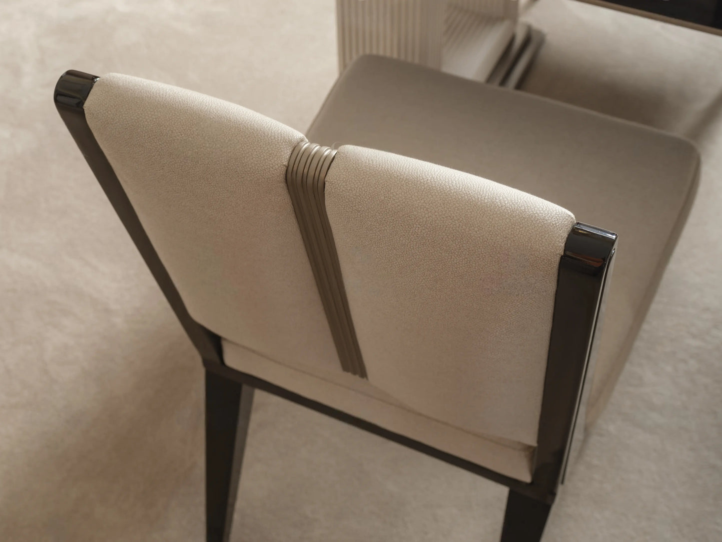 Senato dining chair showing dark wood back frame and cushion