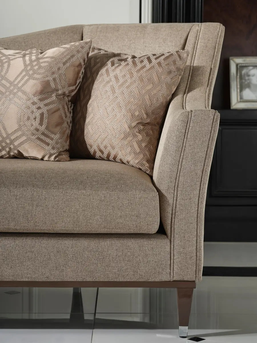 Two cushions in the corner of the Varna sofa, partial sofa visible.