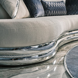 Ferre curved 3 seater zoom up to show metla details and fabrics