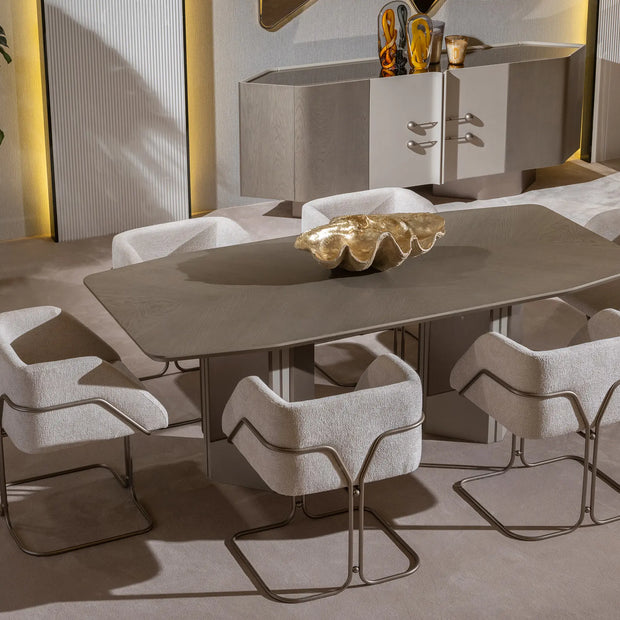 Modern beige dining table with plush chairs