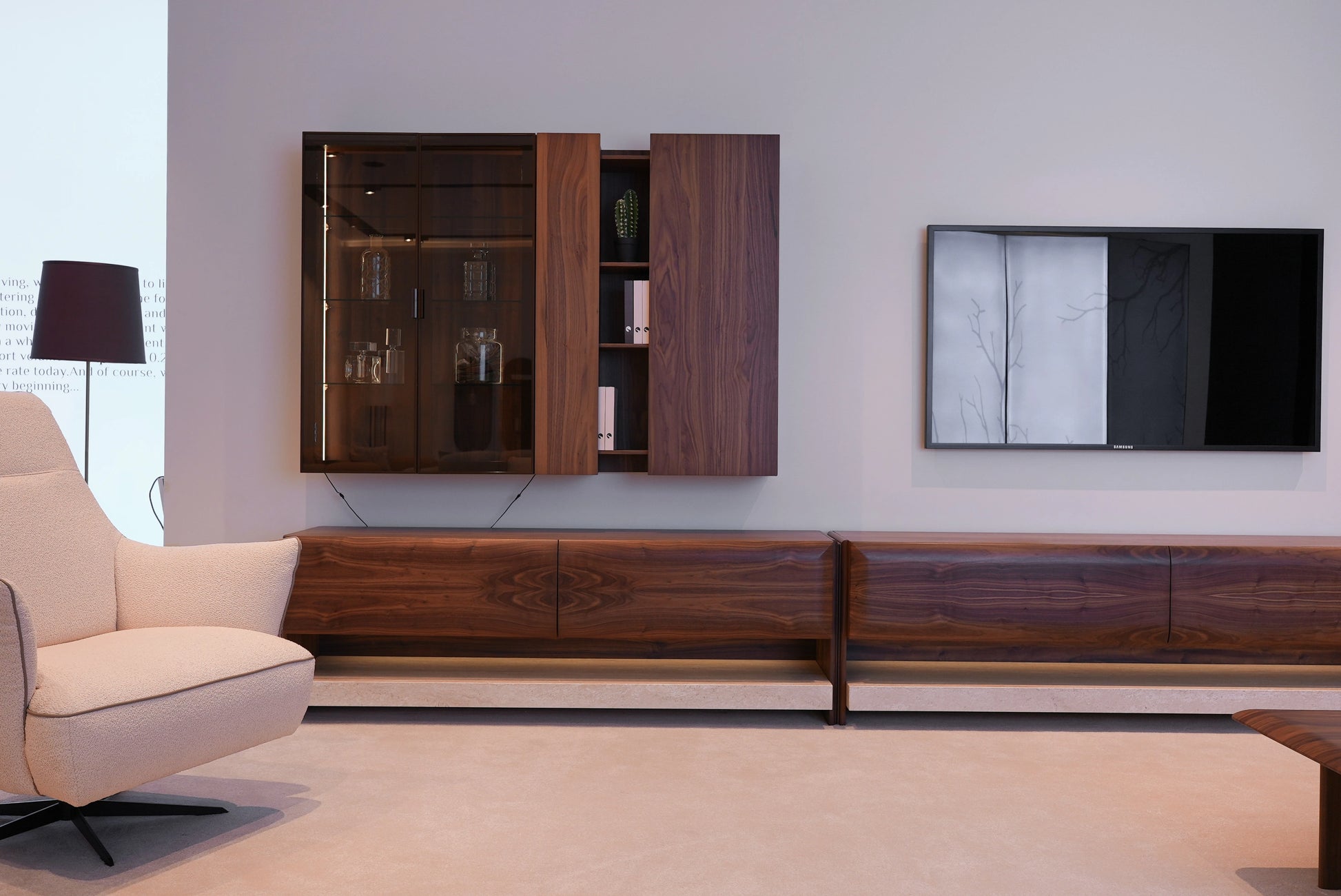 Modern living room Loretta armchair with wooden entertainment center.