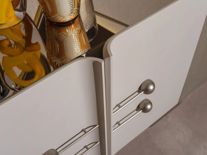 Detail view of Ricamo sideboard with hands opening the elegant storage drawers