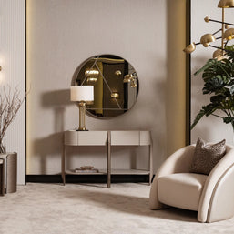 Beige accent chair styled in neutral-toned living room
