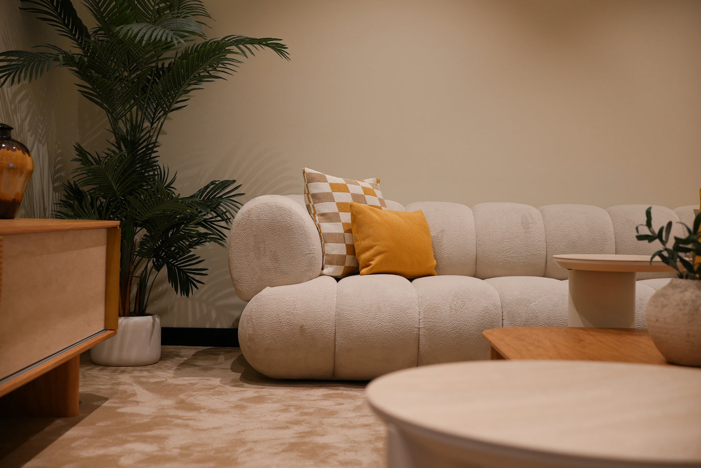 Lia lounge sofa module with plush cushions in cream fabric