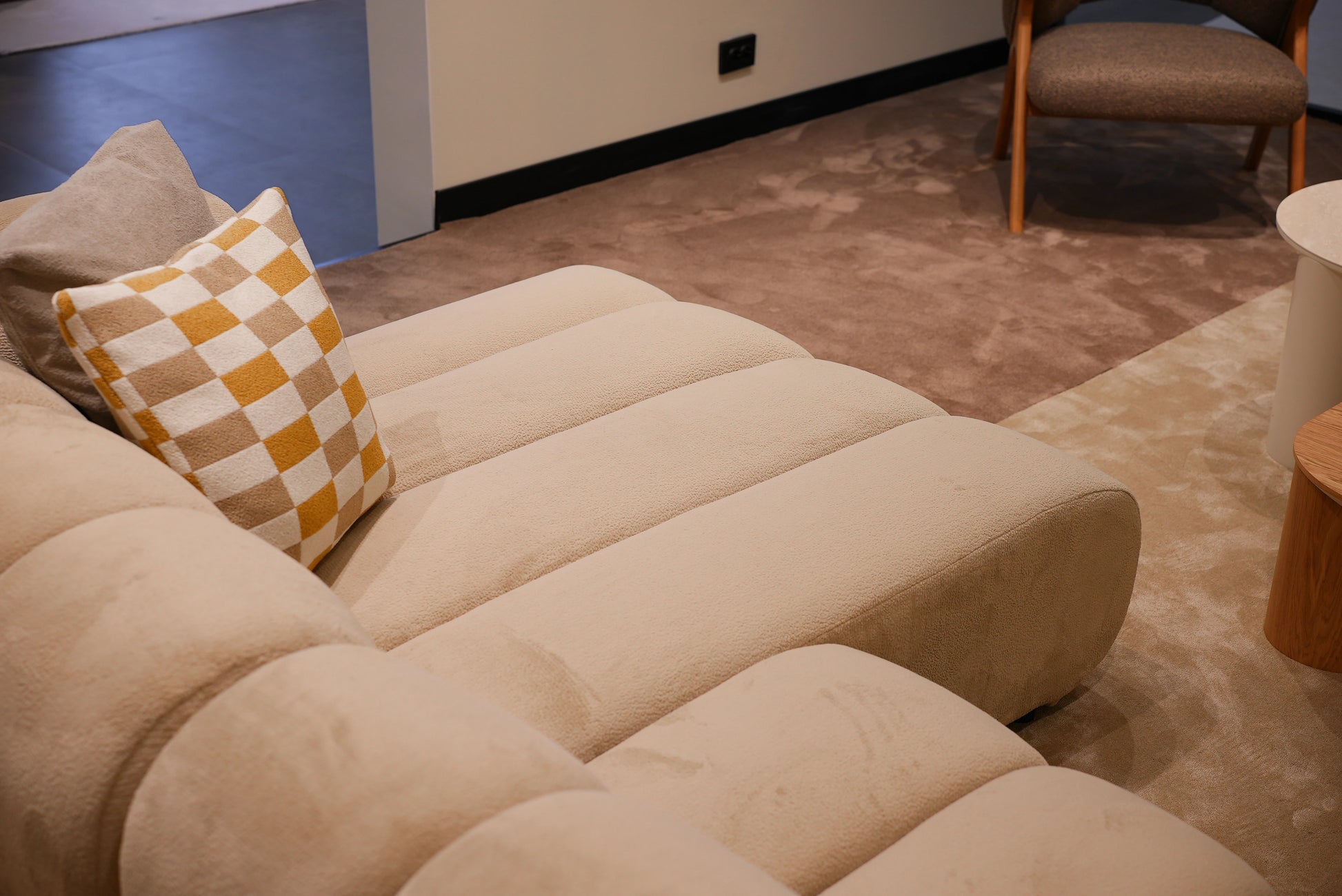 Rear angle of Lia lounge sofa with modern fabric upholstery