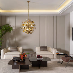 Contemporary living room with two Moka sofas, accent chair, gold pendant light, and plants