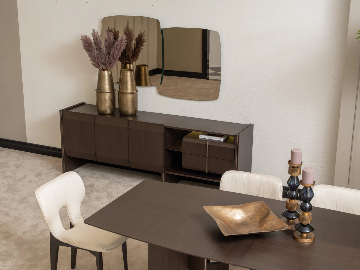 Modern dining room with Moka sideboard, abstract mirror, and cream dining chairs