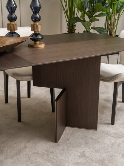 Detailed view of Moka dining table leg design and cream upholstered chair