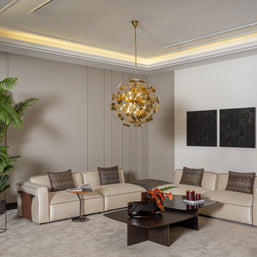 Modern L-shaped Moka sofa suite with brown side pockets, gold pendant light, and wall art