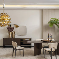 Modern dining room with Moka dining table, cream chairs, and stylish sideboard with gold decor