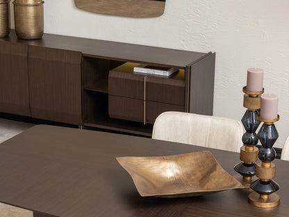 Close-up of Moka sideboard and gold decor beside contemporary dining table