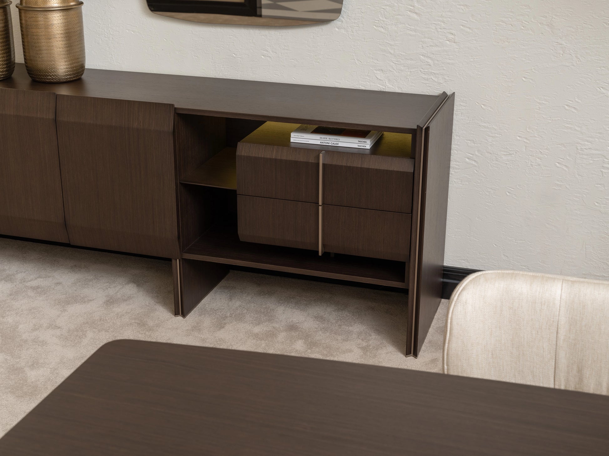 Moka sideboard open shelving with books, detail next to dining chair