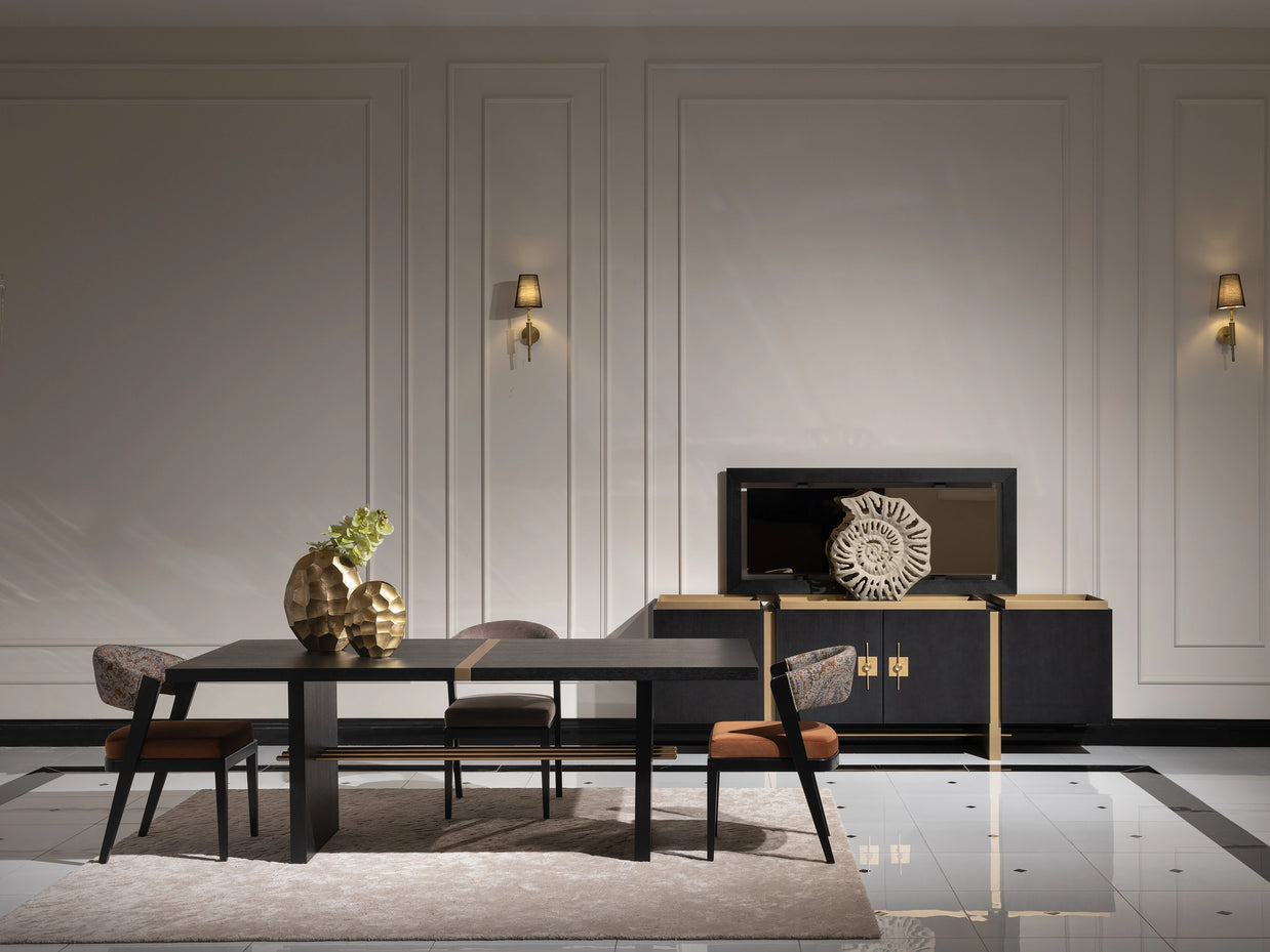 Elegant dining area featuring a black dining table with a decorative centerpiece, surrounded by matching chairs. The room is adorned with sophisticated wall sconces, a decorative sideboard, and a large mirror, creating a luxurious and spacious ambiance.