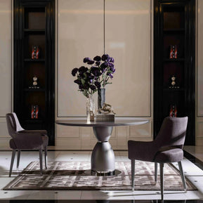 Side view, Porto round table, 2 armchairs, showing table design. Part of the Porto Dining Set. Luxe Life Furniture.