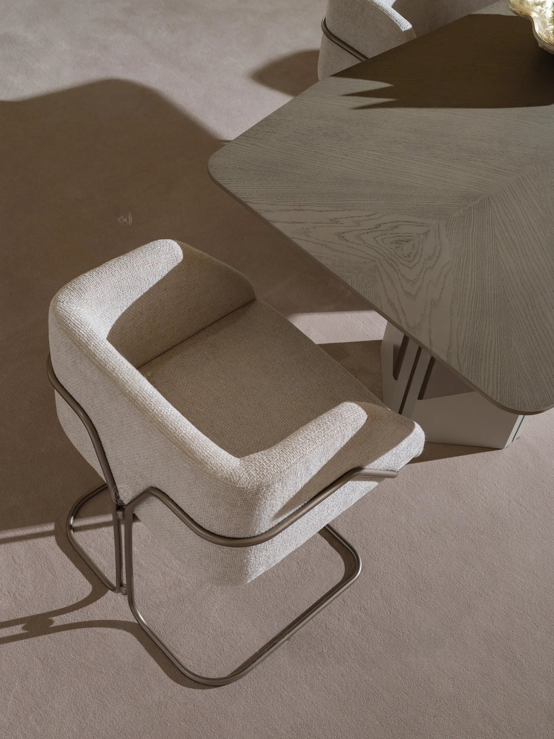 Padded beige dining chair with sleek frame