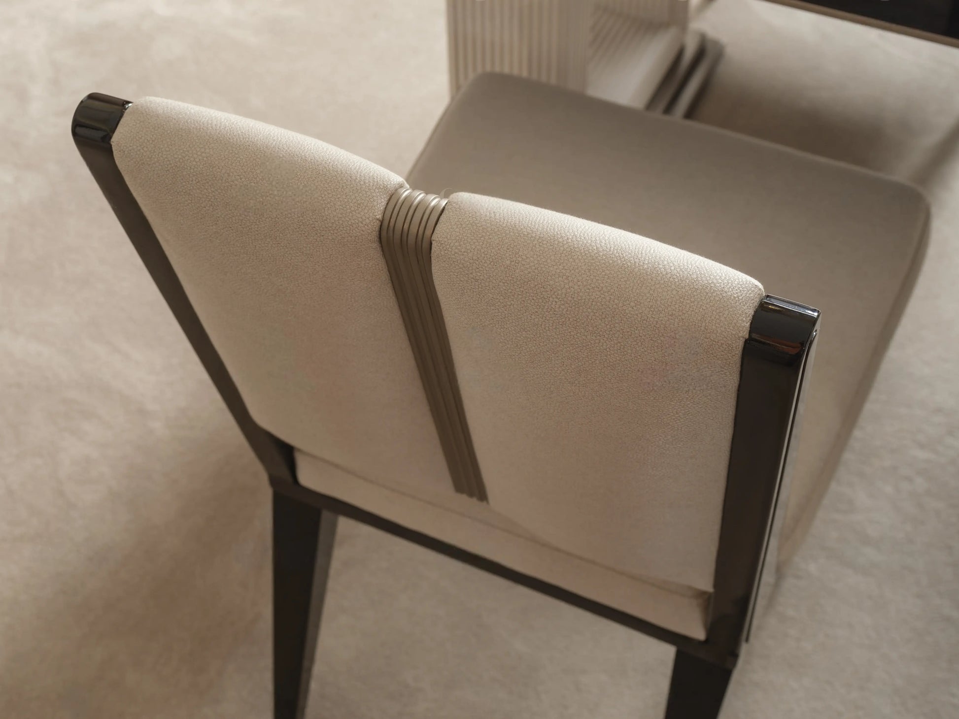 Senato dining chair showing dark wood back frame and cushion