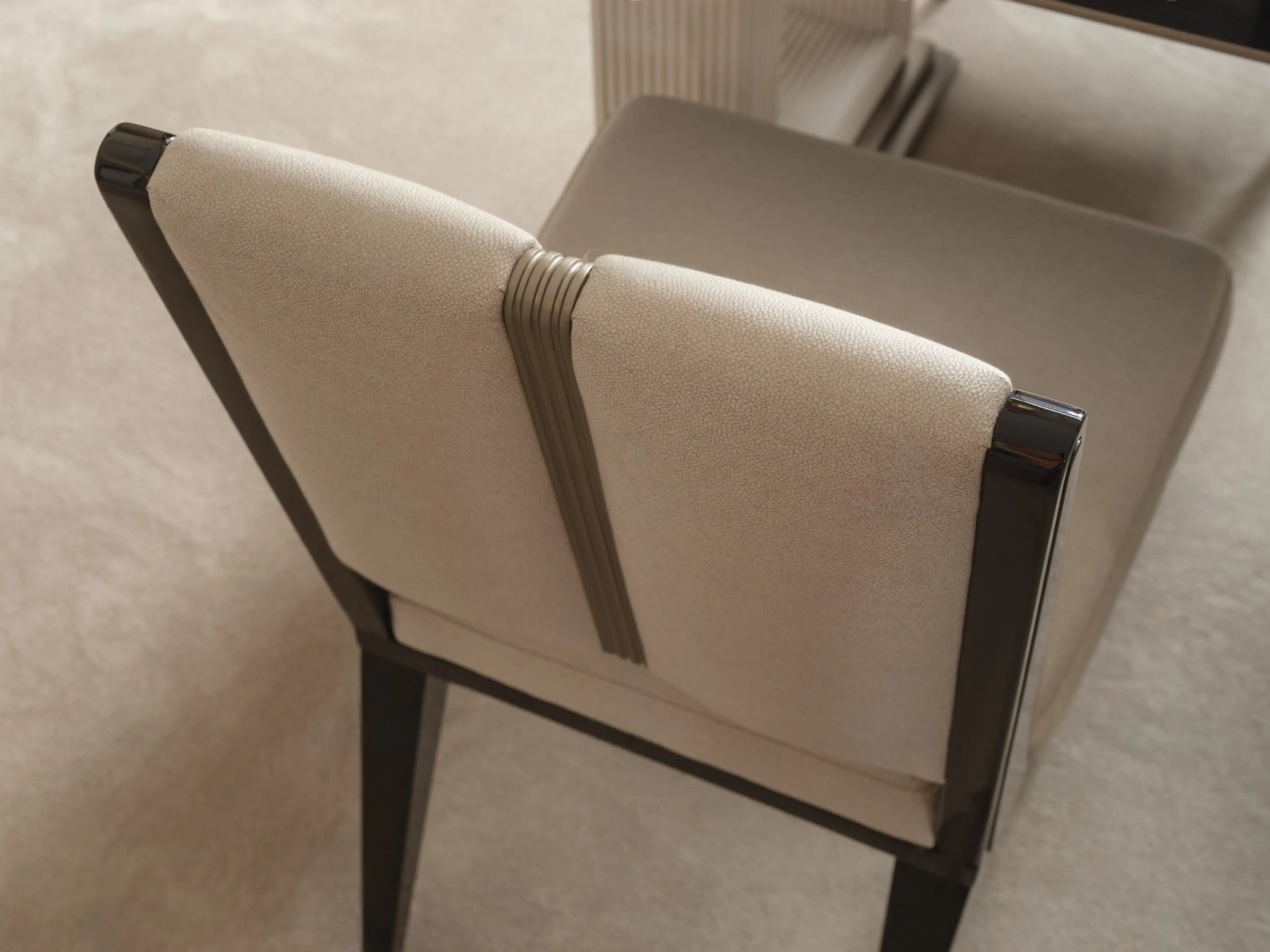 Senato dining chair showing dark wood back frame and cushion