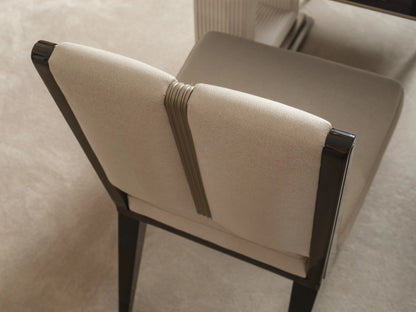 Senato dining chair showing dark wood back frame and cushion