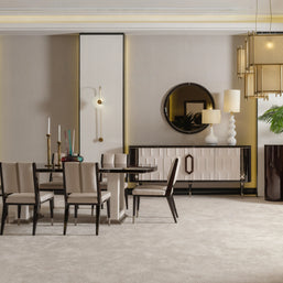 Senato dining table with 6 dining chairs placed beside matching cream sideboard