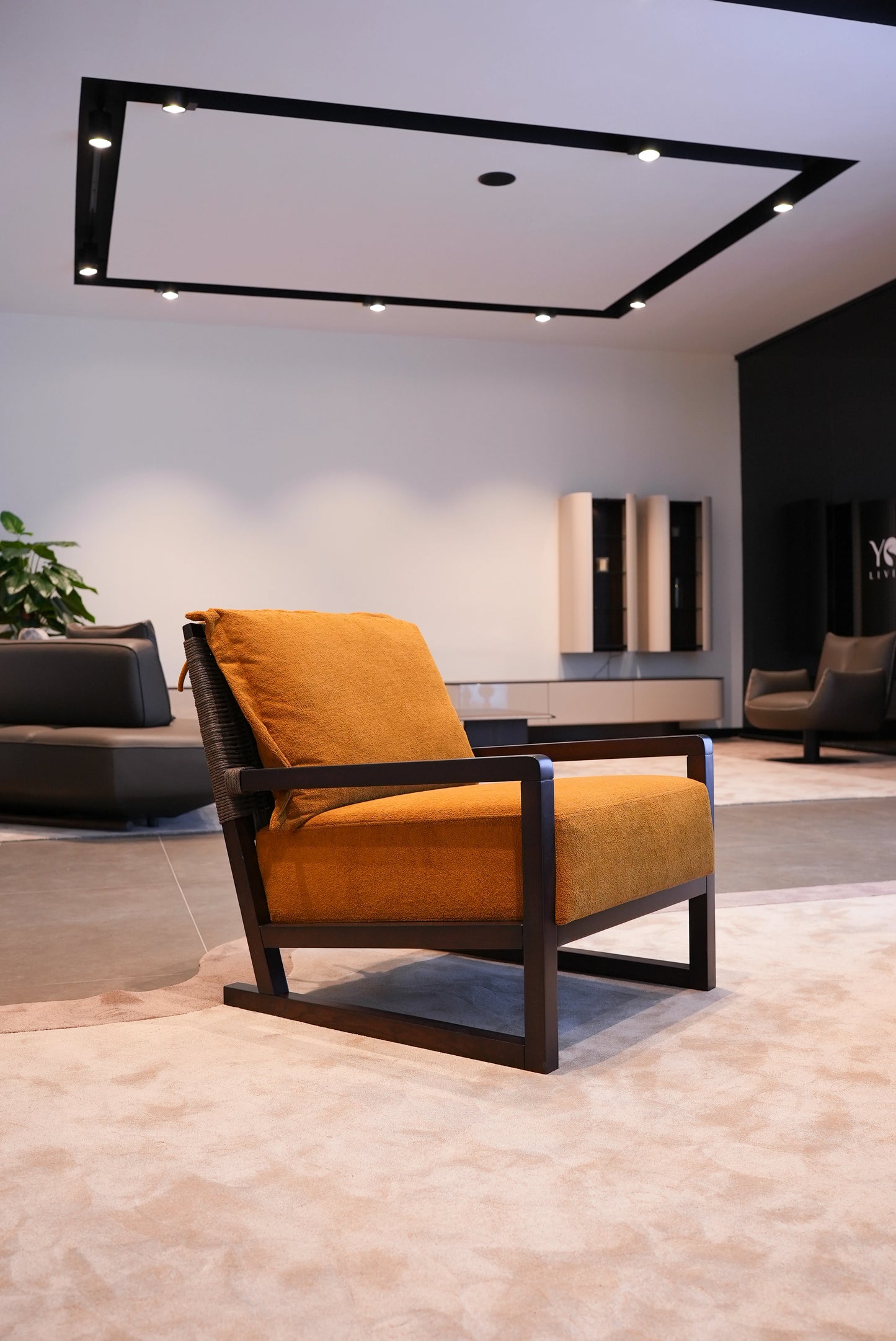 Side view of Simba Arm chair in beige fabric