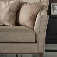 Two cushions in the corner of the Varna sofa, partial sofa visible.