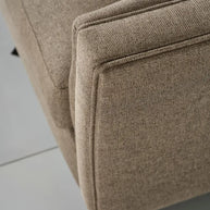 Close-up of Varna 4 seater sofa edge showing fabric and stitch detail.